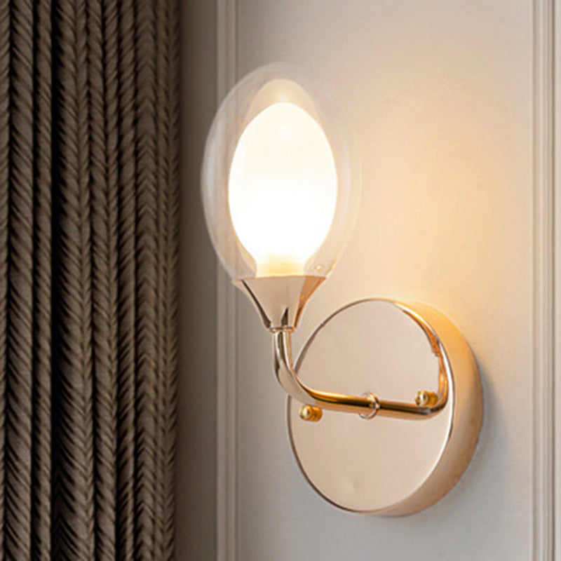 Modern Brass Wall Sconce With Clear Glass Shade - Oval Design For Dining Room