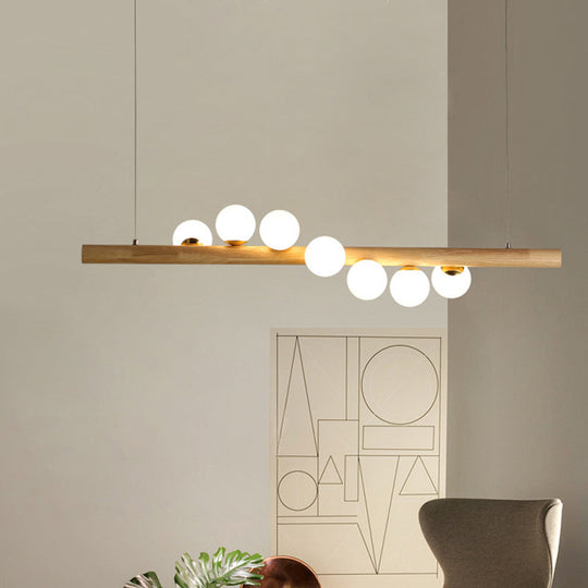 Nordic Wood Island Pendant With Globe Glass Light For Dining Room In Beige