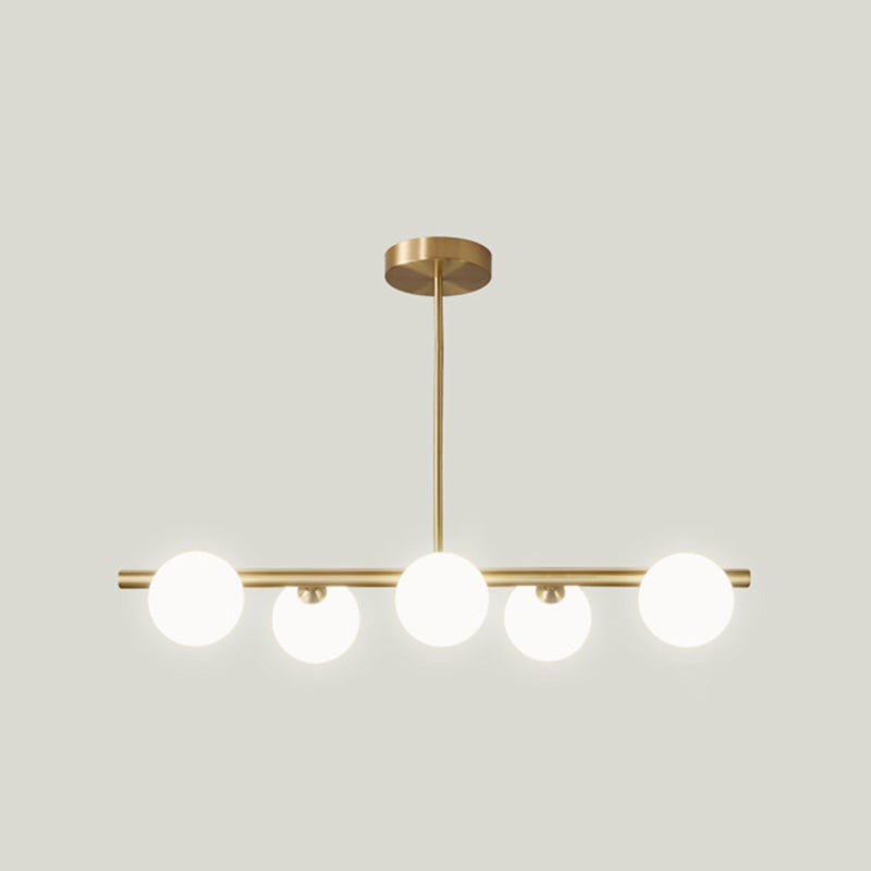 Sleek and Elegant Linear Gold Island Pendant Lighting with Spherical Glass Shades for Dining Table