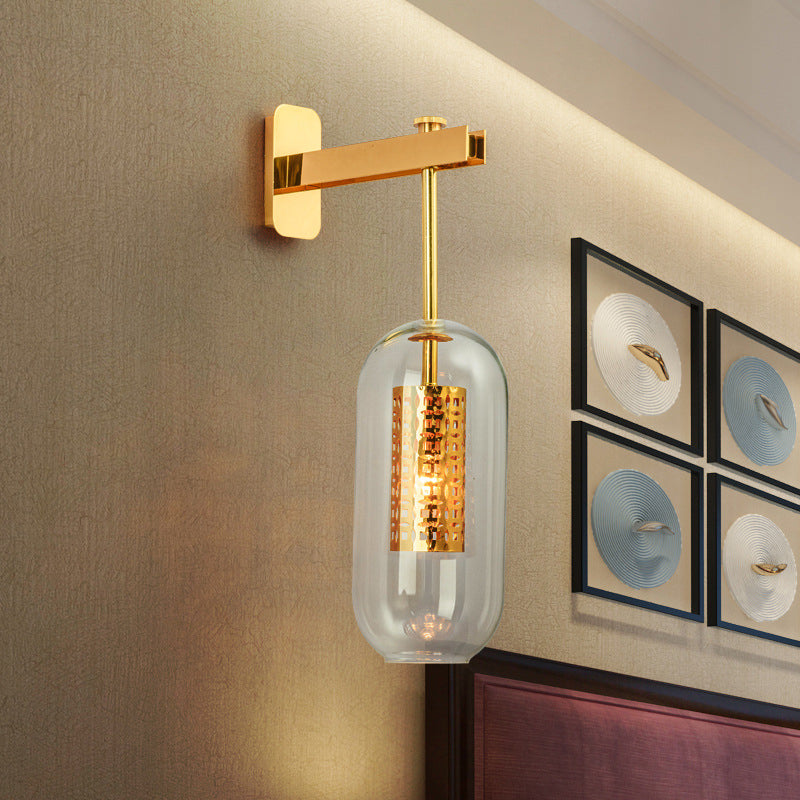 Modern 1-Light Clear Glass Tube Sconce - Brass Bedroom Wall Mount Lamp