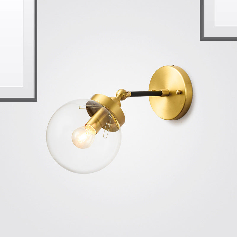 Simplicity Adjustable Globe Sconce Light Brass Wall Mount Lamp - 1 Bulb With Transparent Glass Shade
