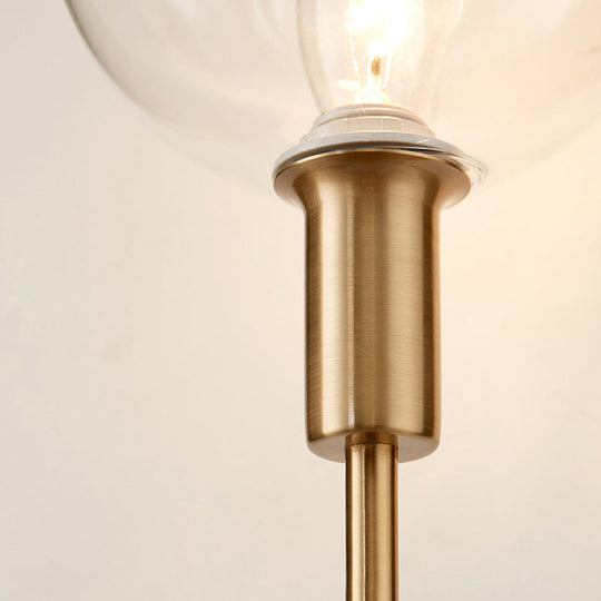 Brass Wall Lamp With Clear Wine Glass Shade & Modern Pencil Arm Design