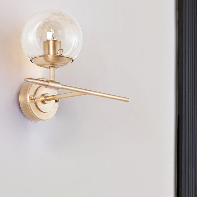 Contemporary Hand Blown Glass Wall Light With Brass Globe And Crossed Arm