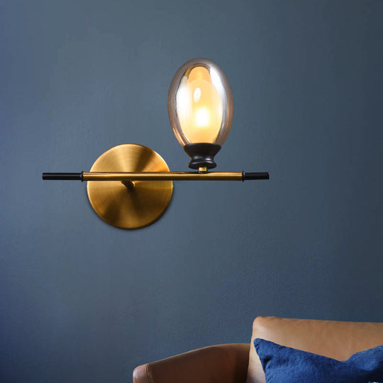 Elegant Clear/Amber Glass Egg Shape Wall Light - Minimalist 1 Brass Sconce