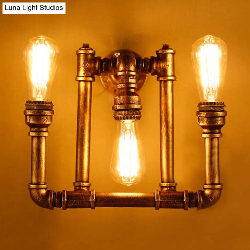 3-Head Industrial Sconce With Wrought Iron Pipe Design In Aged Brass For Hallway