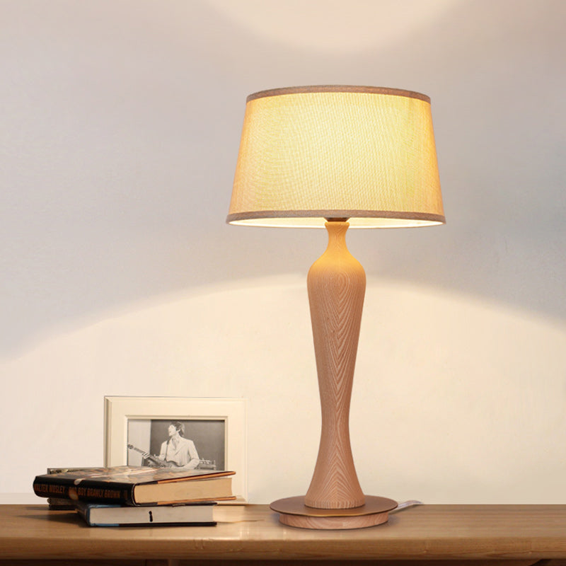 Modern Urn-Shaped Wood Desk Lamp In Beige - 1 Bulb Table Light With Drum Fabric Shade