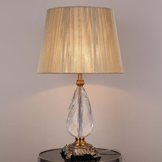 Modern Beige Table Lamp With Flared Wide Base And Fabric Shade