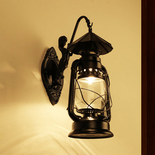 Coastal Single Bulb Kerosene Glass Wall Sconce In Black/Antique Brass For Living Room