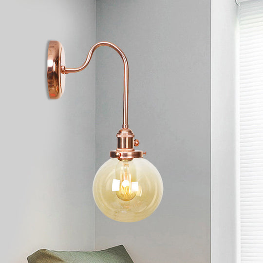 Copper Vintage Globe Wall Sconce With Curved Arm And Clear/Amber Glass - 1 Light Amber / A