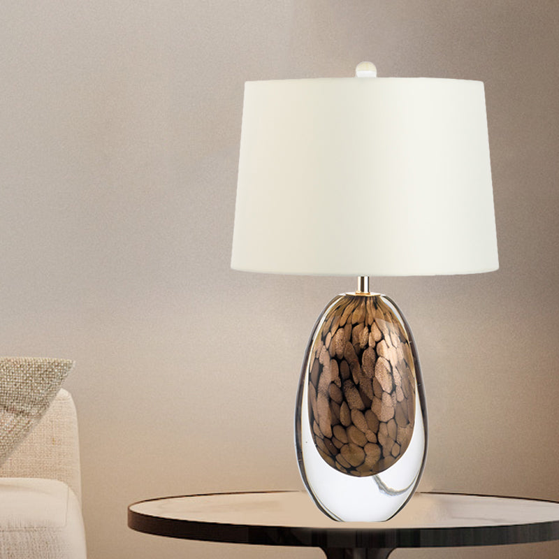 Modernist White Fabric Table Lamp With Colored Glaze Base - Oval Drum Nightstand Light