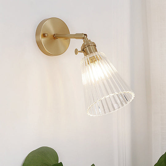 Clear Textured Glass Wall Sconce With Brass Accents For Industrial Dining Room Lighting