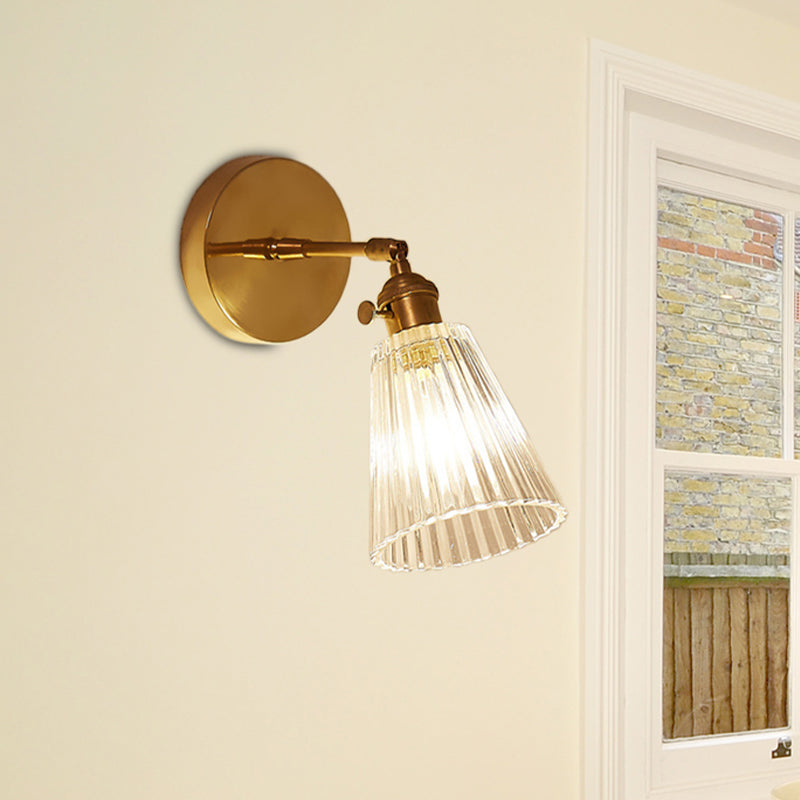Clear Textured Glass Wall Sconce With Brass Accents For Industrial Dining Room Lighting