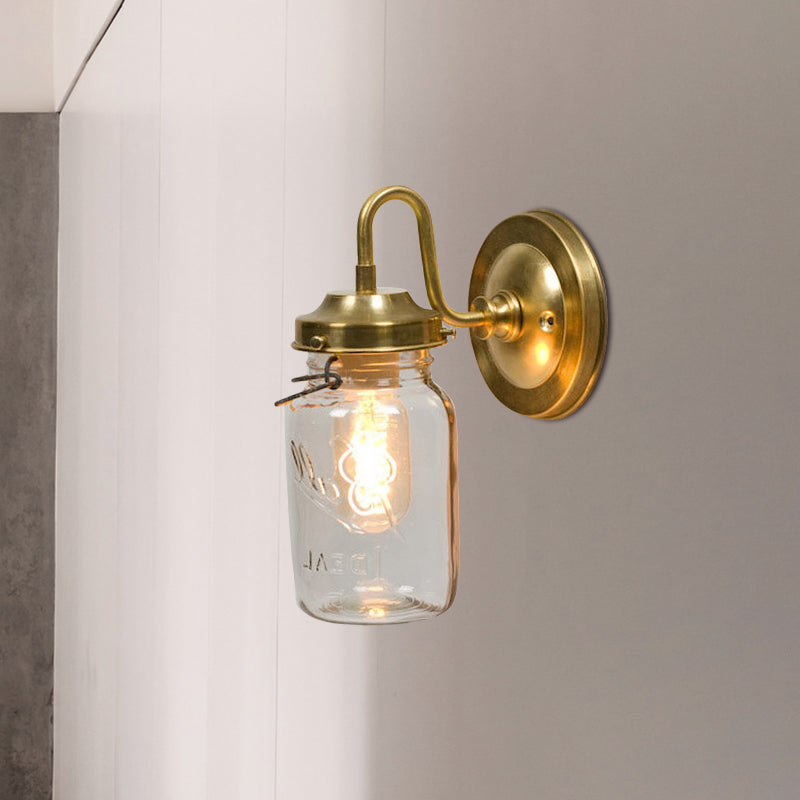 Industrial Clear Glass Wall Sconce With Brass Finish And Letter Detail