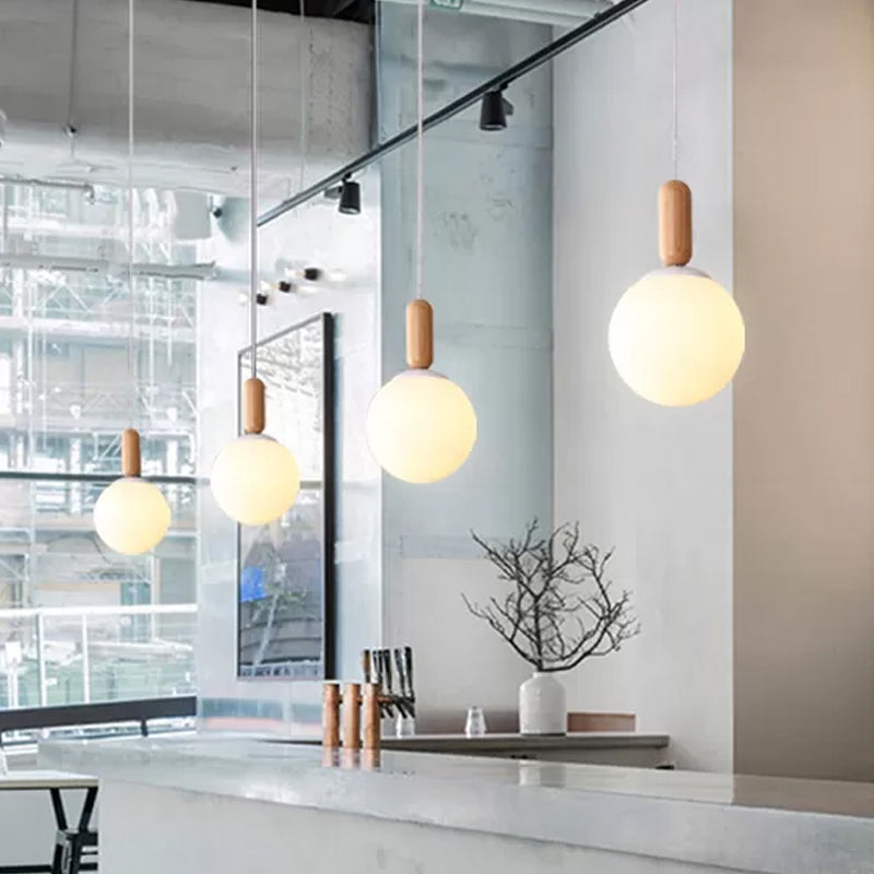 Sleek Sphere Kitchen Pendant Light: White/Cognac Glass Minimalist Design With Wood Grip