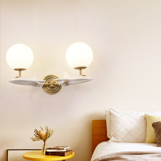 Gold Spaceship Wall Sconce With Cream Glass Globe For Kids Room - 1/2 Bulb Fixture In White & 2 /