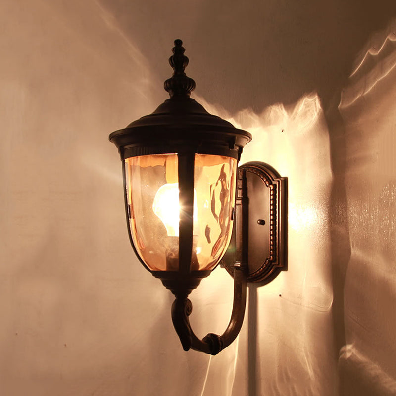 Traditional Wall Sconce: 1-Light Black Lamp With Amber Water Glass Urn Shade