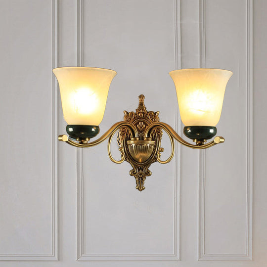 Traditional Brass Floral Wall Lamp With Frosted Glass And Carved Backplate