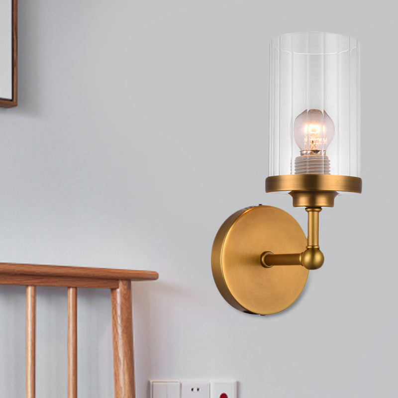 Postmodern 1-Head Brass Cylinder Wall Lighting With Clear Ribbed Glass Mount