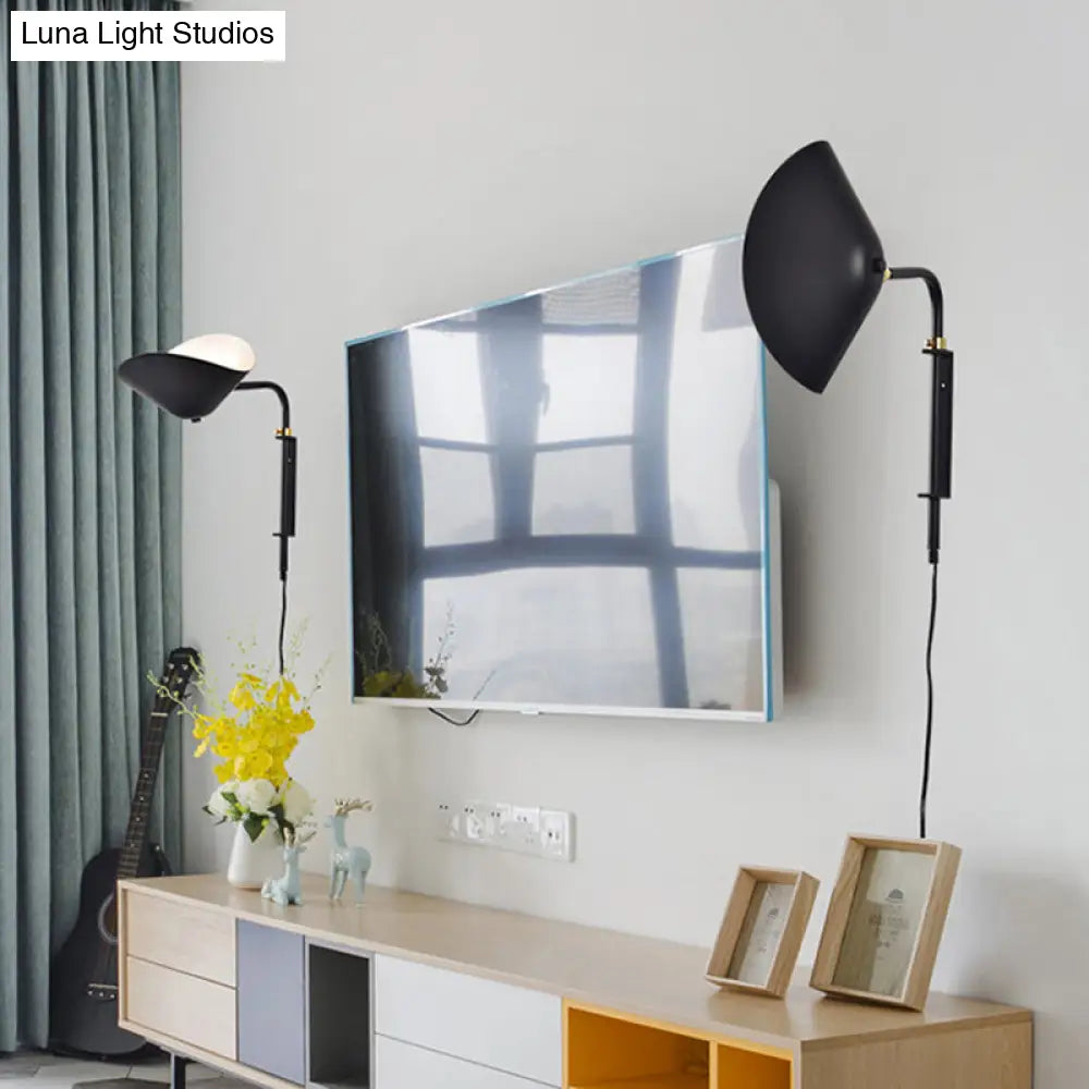 Adjustable 1-Light Living Room Sconce With Waveform Metal Shade - Black Finish