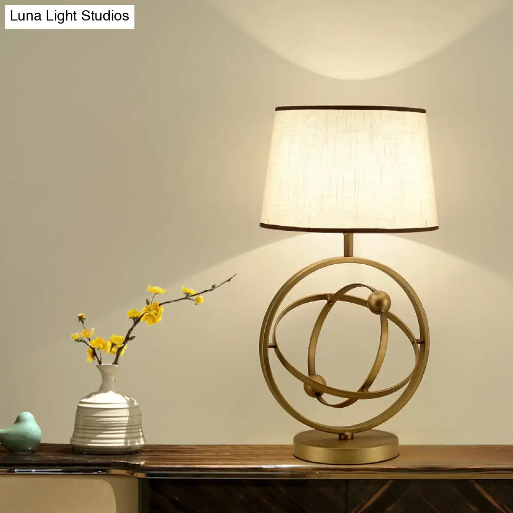 Conic Night Lamp With White/Green Traditional Fabric Shade And Orbit/Lotus Seedpod Base