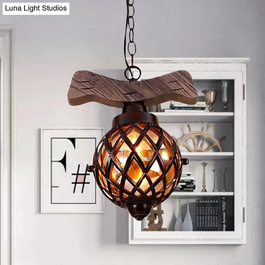 Amber Glass Ball Pendant Lamp With Wooden Base - 1 Light Country Hanging In Copper
