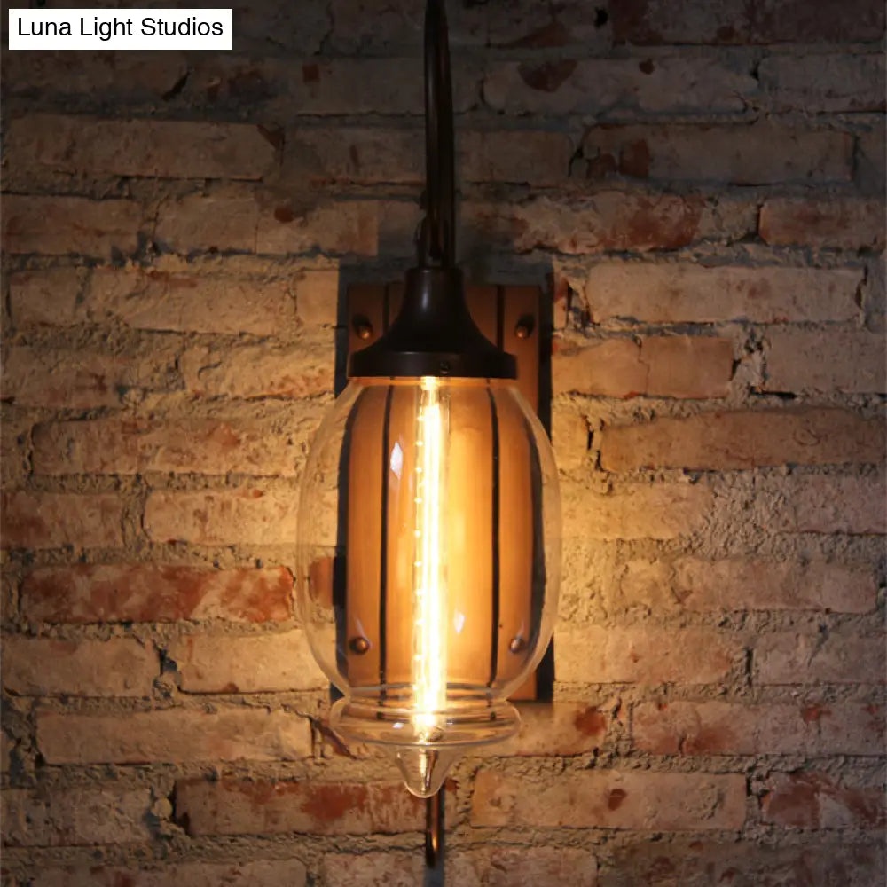 Antique Black Glass Oval Wall Lamp With Swirl Arm - Single Light Lighting Fixture