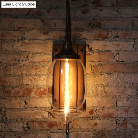 Antique Black Glass Oval Wall Lamp With Swirl Arm - Single Light Lighting Fixture