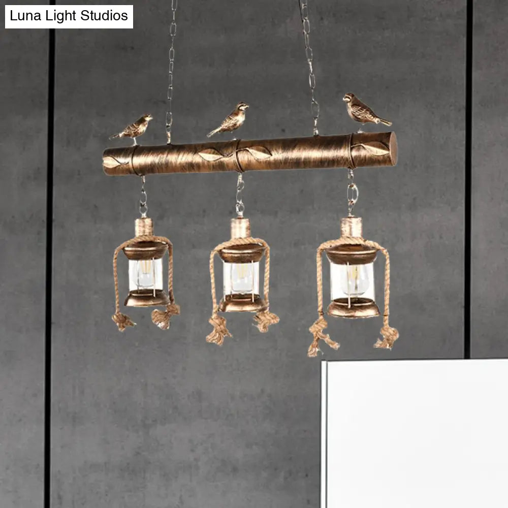 Antique Brass Lantern Pendant With Clear Glass And Bird Accent - 3-Light Coastal Island Kit