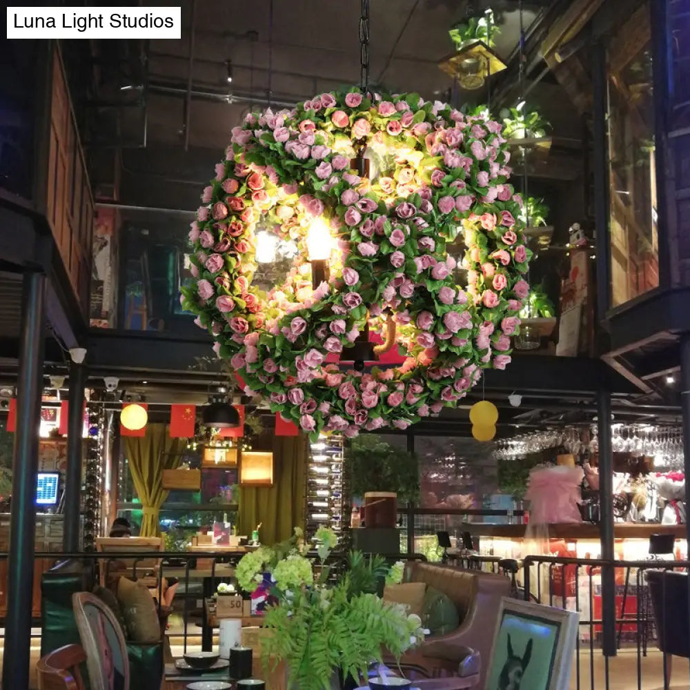 Antique Iron Chandelier With Sphere Design And Three Black Pendant Lights By Candlestick Restaurant