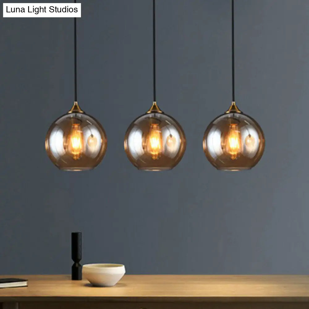 Antiqued Brass Globe Pendant Lamp With Postmodern Design And Glass Shades Amber / Linear