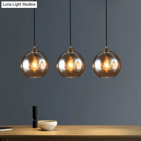 Antiqued Brass Globe Pendant Lamp With Postmodern Design And Glass Shades Amber / Linear