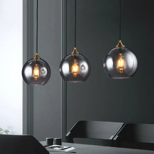 Antiqued Brass Globe Pendant Lamp With 3 Lights And Glass Shade Smoke Gray / Linear