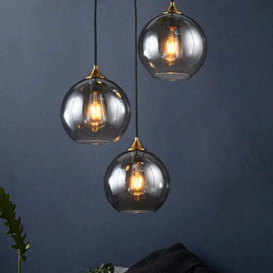 Antiqued Brass Globe Pendant Lamp With 3 Lights And Glass Shade Smoke Gray / Round