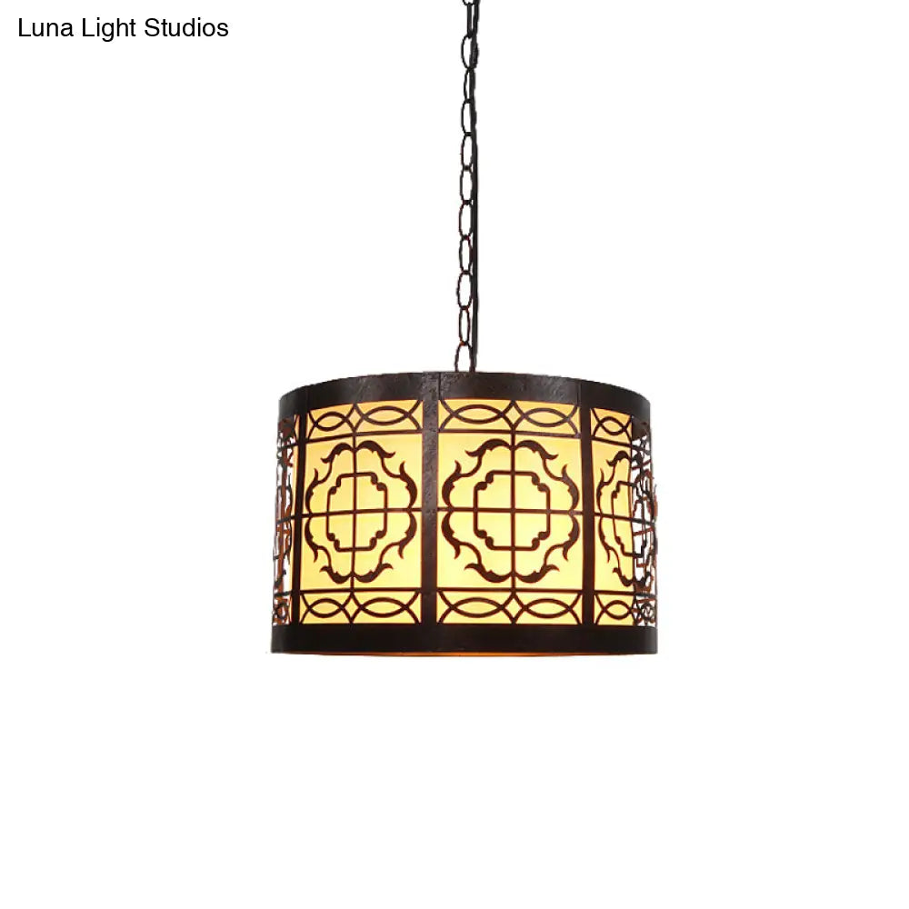 Antiqued Bronze 1-Light Drum-Shaped Pendant Ceiling Light With Rustic Metal Cutouts And