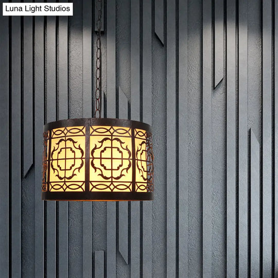 Antiqued Bronze 1-Light Drum-Shaped Pendant Ceiling Light With Rustic Metal Cutouts And