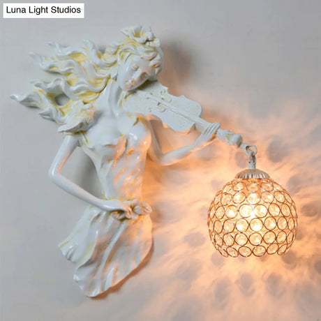 Antiqued Girl With Violin Wall Lamp: Single Bulb Resin Sconce Clear Crystal Shade In White/Gold