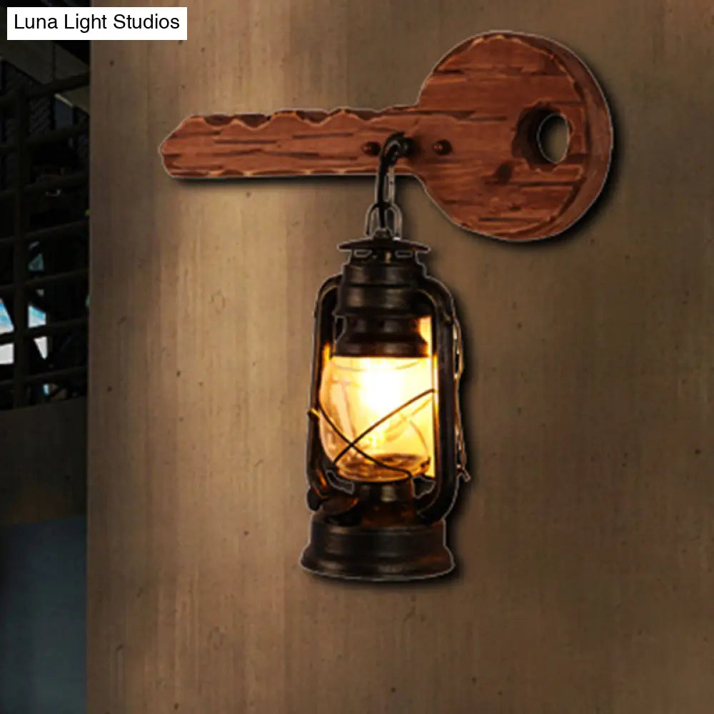 Antiqued Kerosene Wall Sconce With Clear Glass And Wood Leaf/Key Backplate For Dining Room Lighting