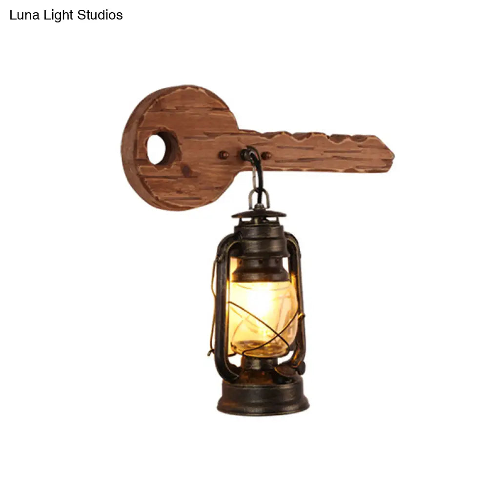 Antiqued Kerosene Wall Sconce With Clear Glass And Wood Leaf/Key Backplate For Dining Room Lighting