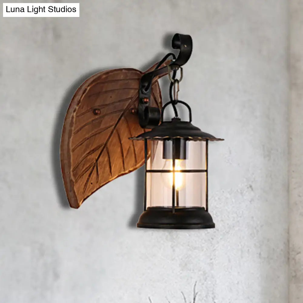 Antiqued Kerosene Wall Sconce With Clear Glass And Wood Leaf/Key Backplate For Dining Room Lighting