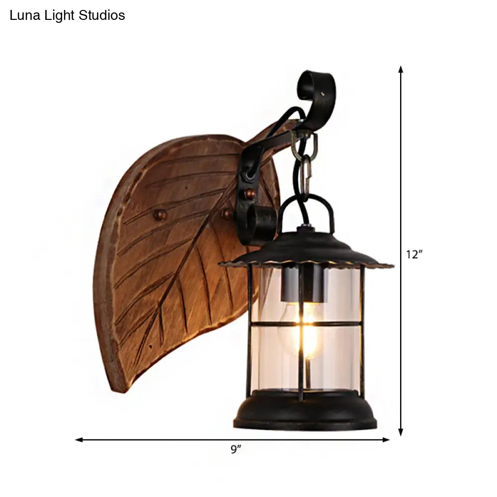 Antiqued Kerosene Wall Sconce With Clear Glass And Wood Leaf/Key Backplate For Dining Room Lighting