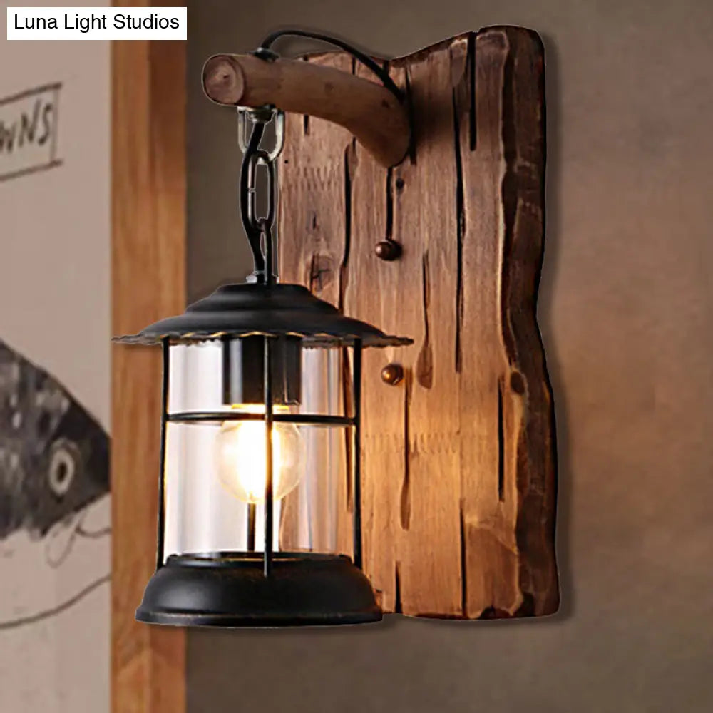 Antiqued Kerosene Wall Sconce With Clear Glass And Wood Leaf/Key Backplate For Dining Room Lighting