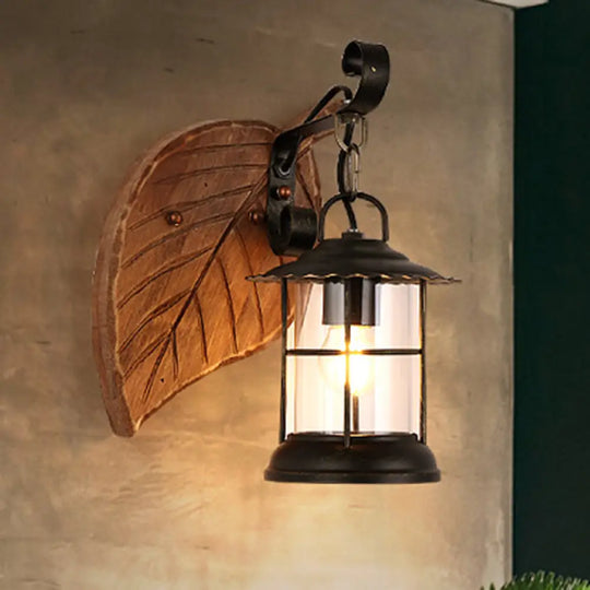 Antiqued Kerosene Wall Sconce With Clear Glass And Wood Leaf/Key Backplate For Dining Room Lighting