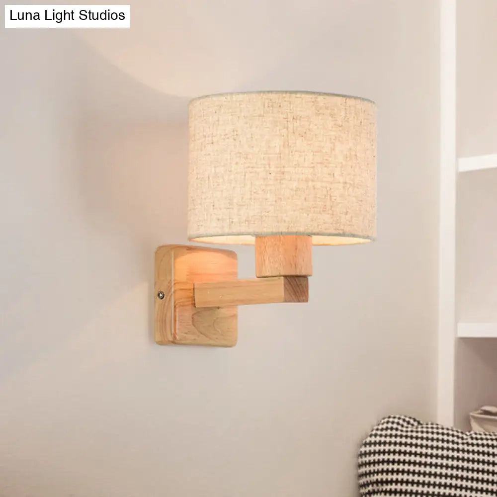 Asian Inspired Drum Wall Lamp With Wood Arm And Fabric Shade 1-Light Fixture For Bedroom