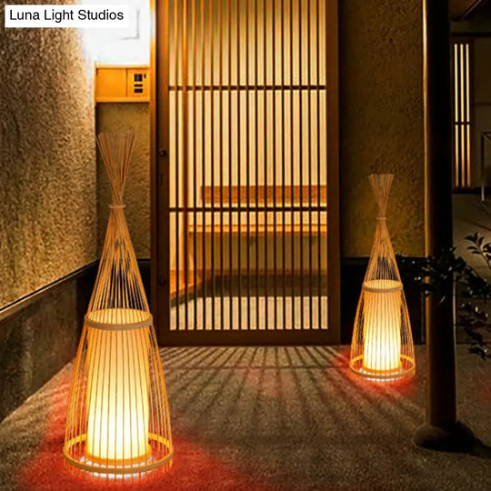 Bamboo Floor Lamp From South-East Asia With Tapered Design And Cylindrical Shade