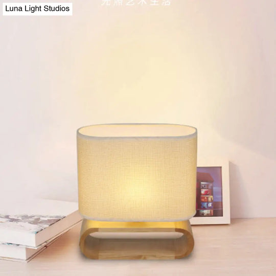 Minimalistic Wood Oval Nightstand Lamp - Single Fabric Table Light For Kids Bedroom