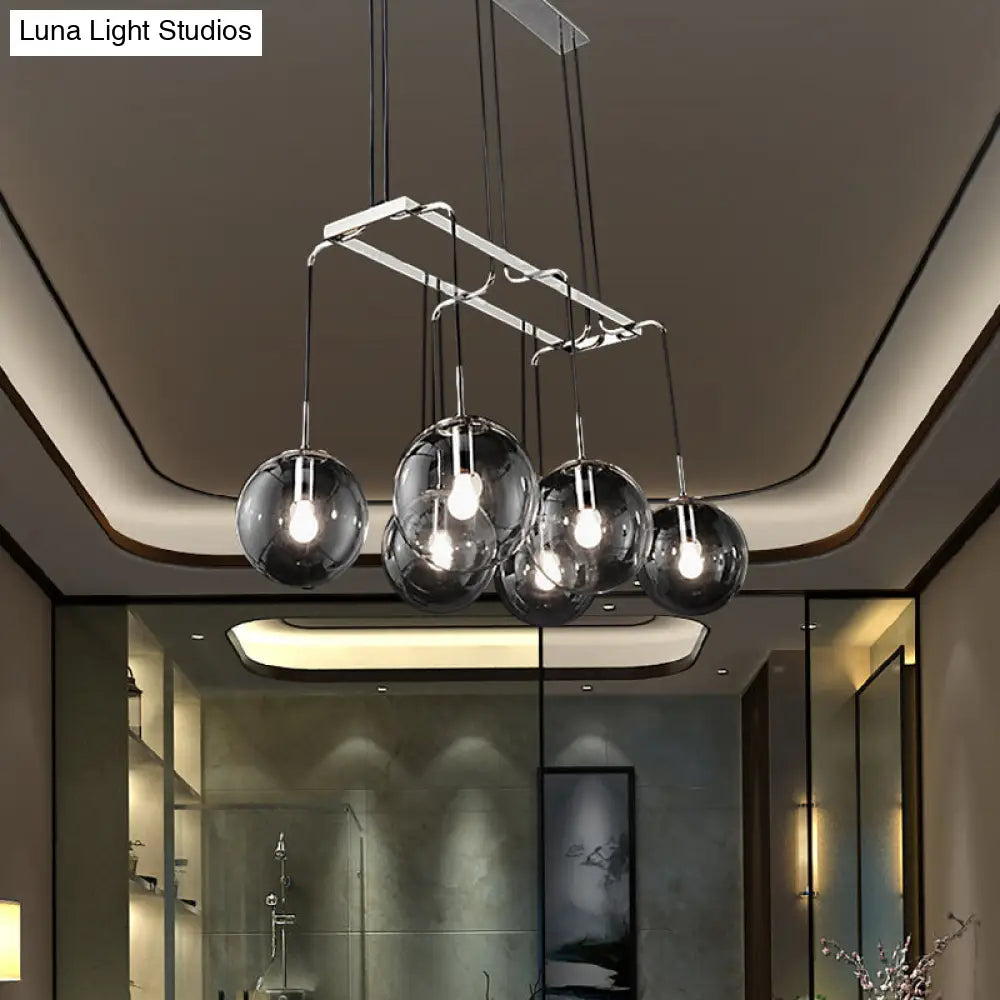 Industrial Black Ball 6-Light Pendant With Clear Glass And Linear Canopy Smoke Gray