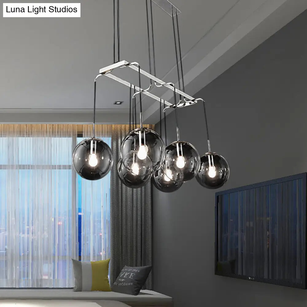 Industrial Black Ball 6-Light Pendant With Clear Glass And Linear Canopy