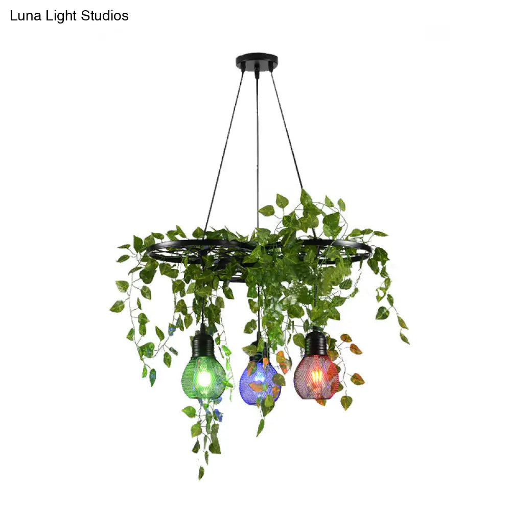 Black Iron Wheel 3-Head Pendant Light With Green Vine Detail And Globe Cage Design