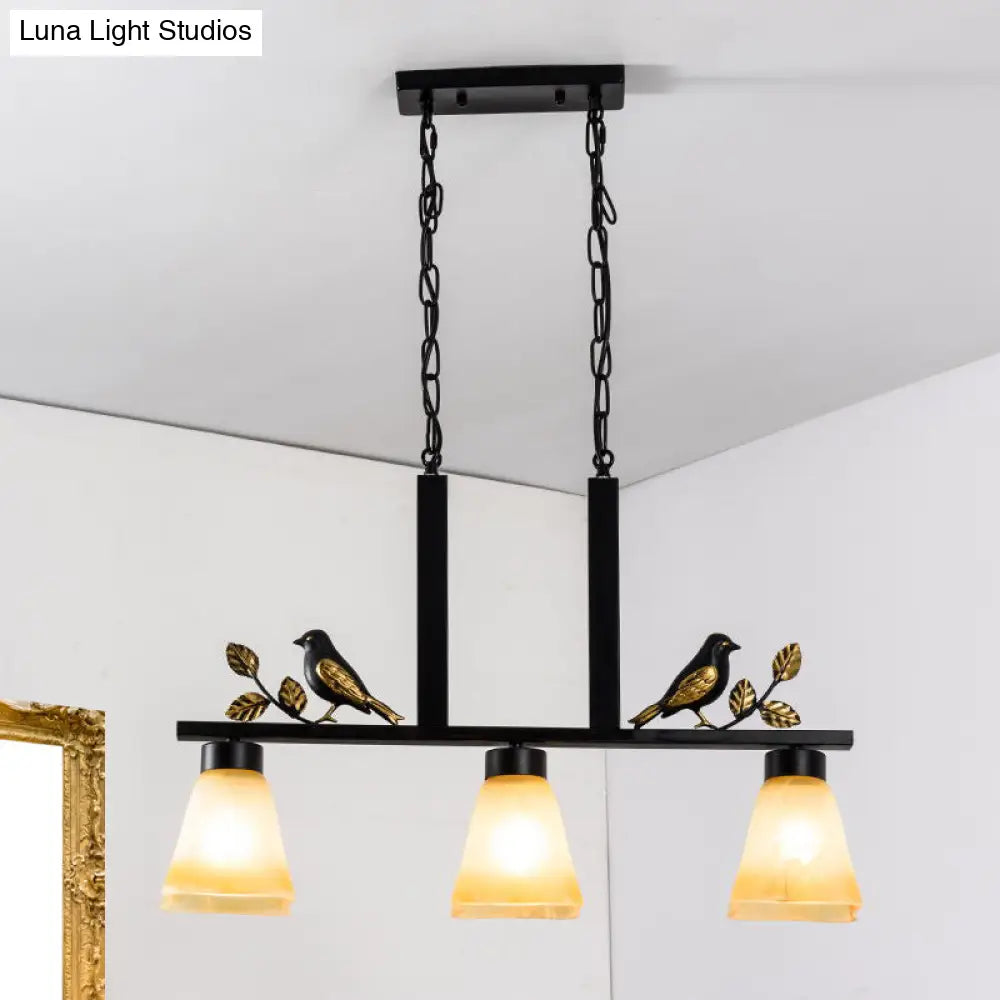 Black Island Pendant With 3 Tan Glass Shades And Bird Deco - Traditional Dining Room Ceiling Light