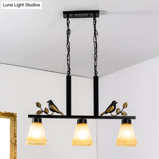 Black Island Pendant With 3 Tan Glass Shades And Bird Deco - Traditional Dining Room Ceiling Light